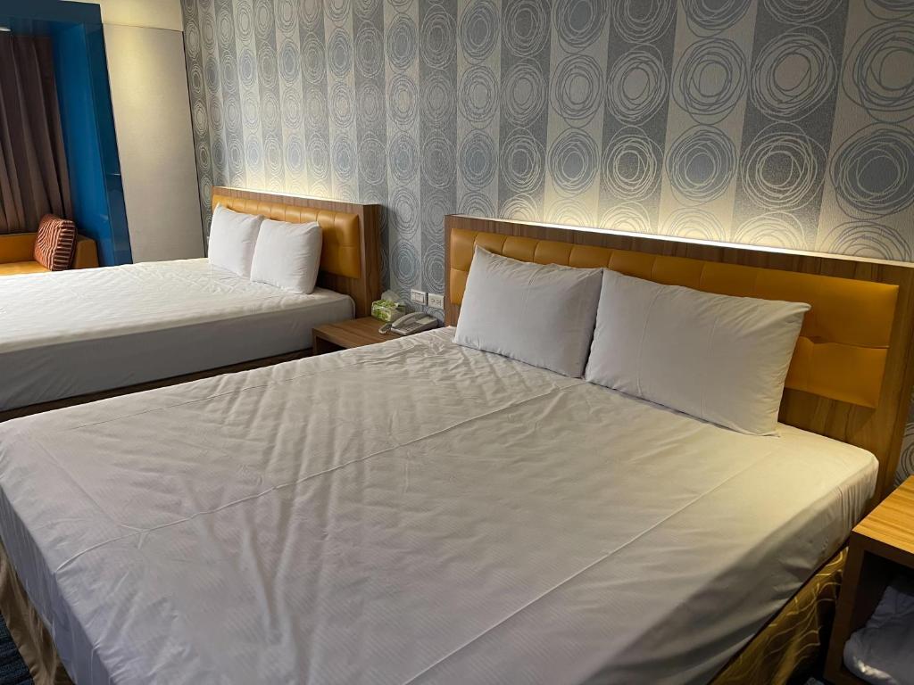 Voodi või voodid majutusasutuse Yiting Hotel toas