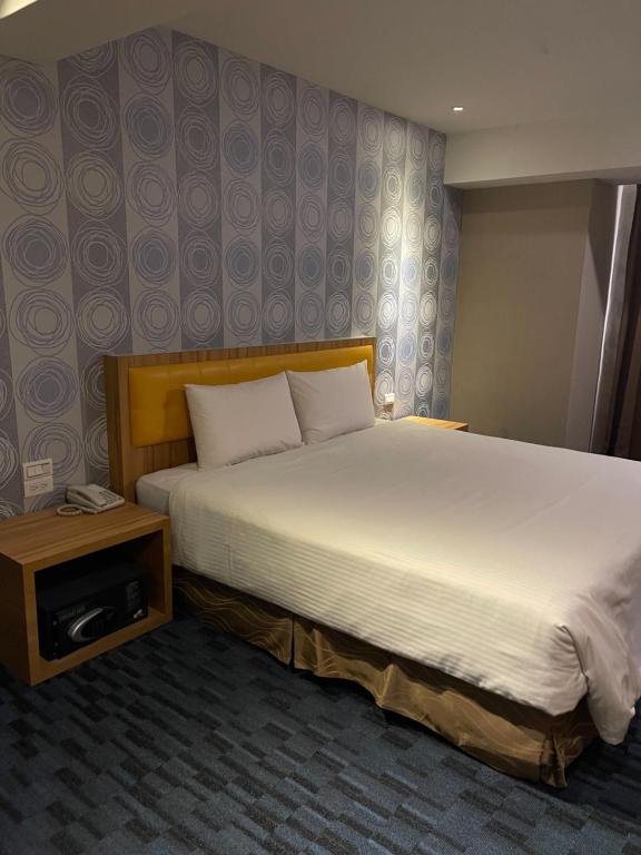 Voodi või voodid majutusasutuse Yiting Hotel toas