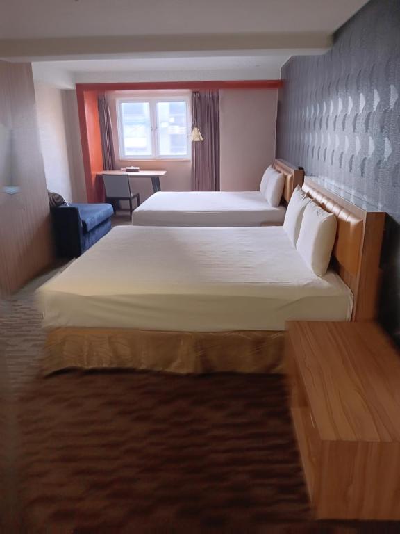 Voodi või voodid majutusasutuse Yiting Hotel toas