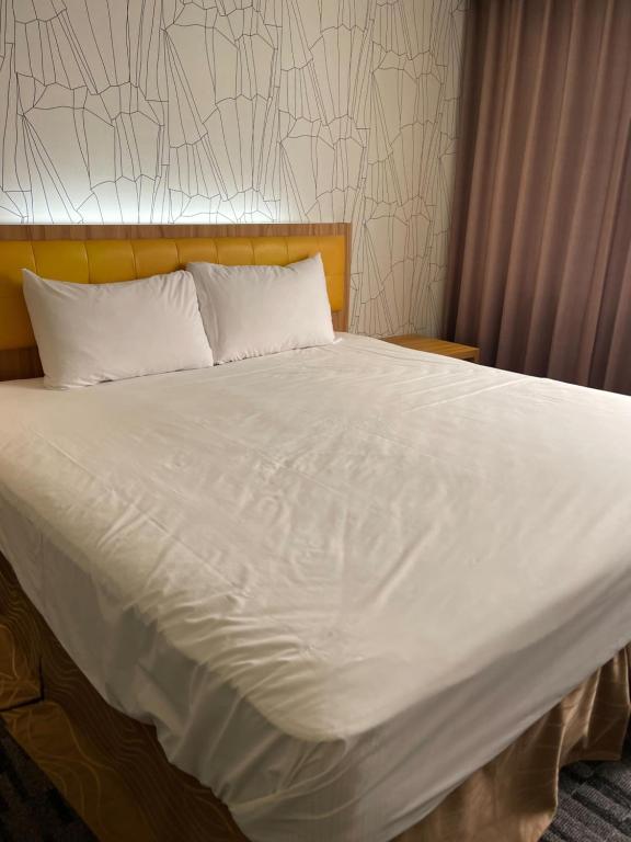 Voodi või voodid majutusasutuse Yiting Hotel toas