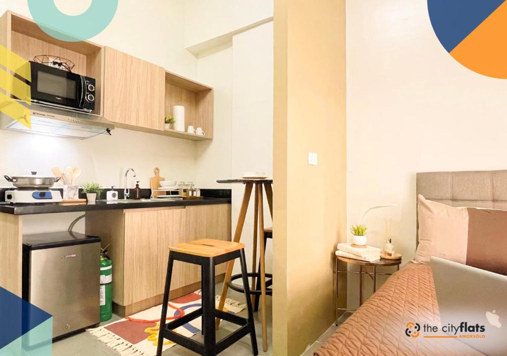 Kuchyň nebo kuchyňský kout v ubytování The City Flats Amorsolo
