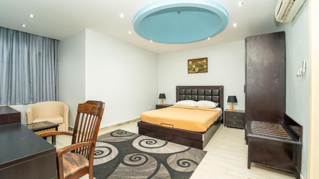 Postel nebo postele na pokoji v ubytování Al Dar Inn Hotel Apartment
