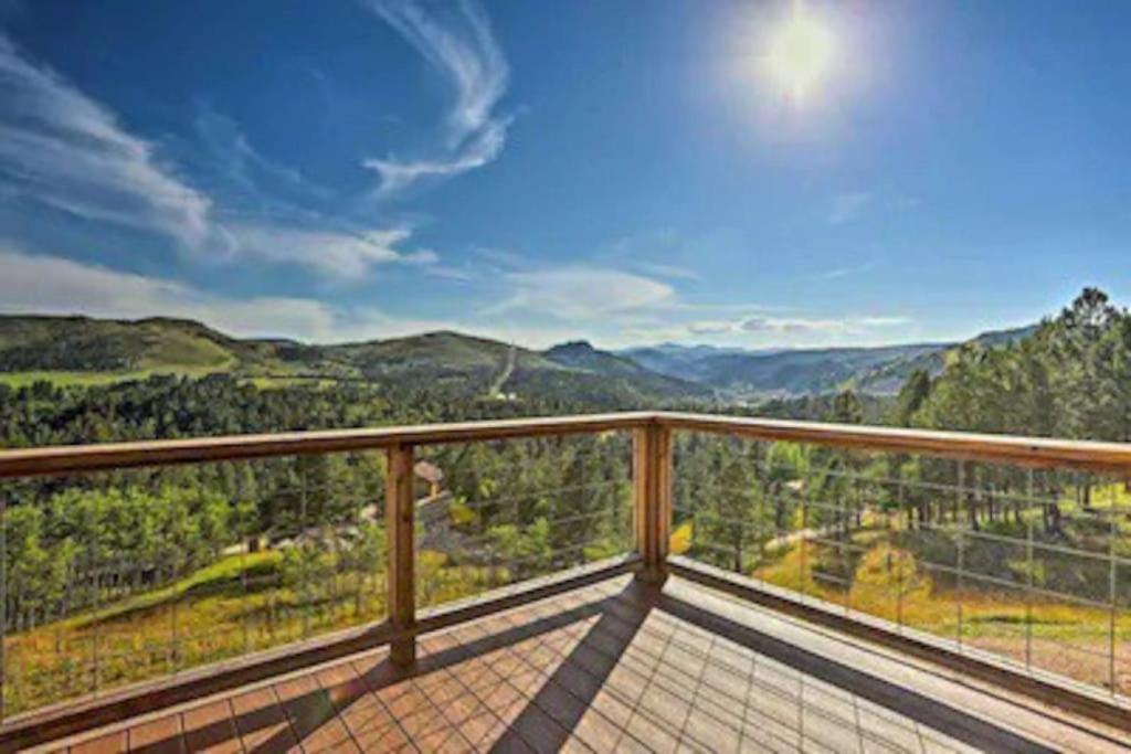 a balcony with a view of the mountains at THE DEADWOOD DREAM in South Dakota in Sturgis