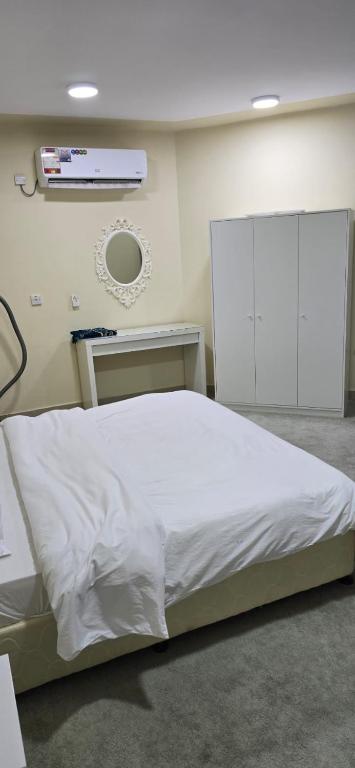 Postel nebo postele na pokoji v ubytování معيذر للشقق المفروشه