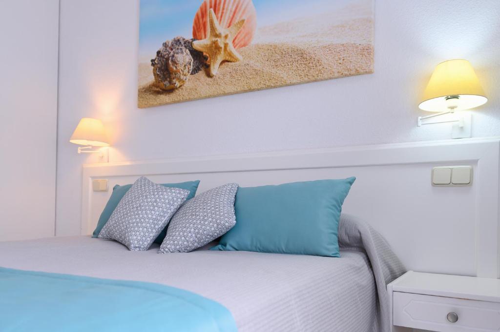 Postel nebo postele na pokoji v ubytování Valle Marina Apartamentos