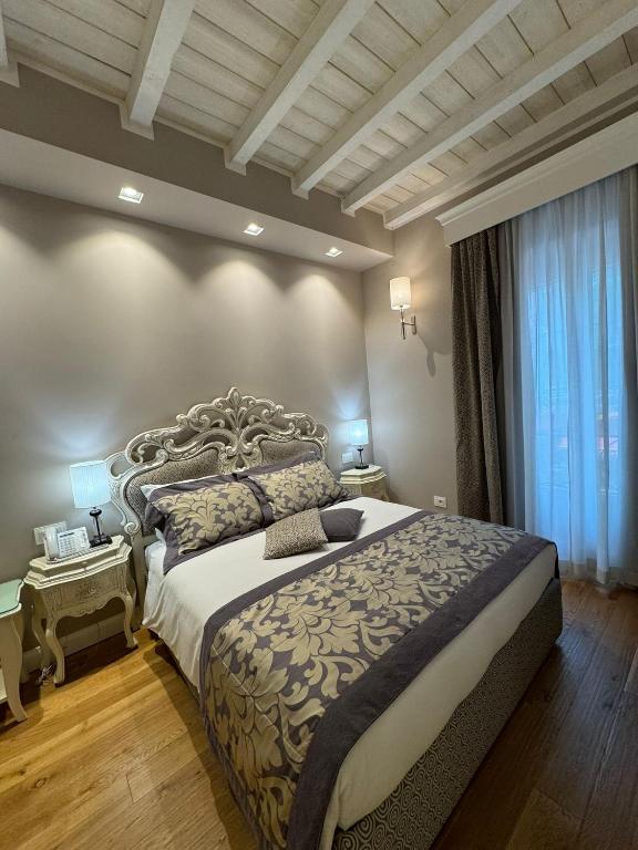 a bedroom with a large bed in a room at Domus Camillus in Milan