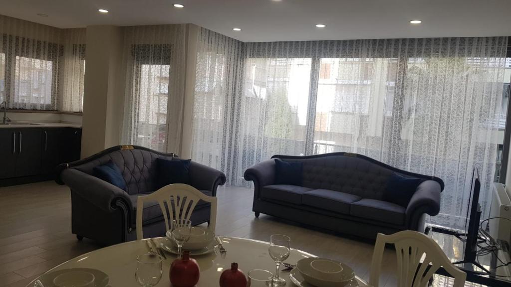 a living room with two couches and a table at 6 Central Location, Close To Beaches And Anywhere in Antalya