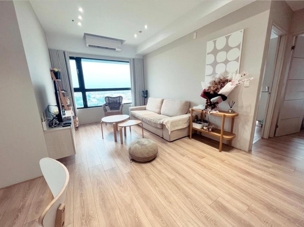 a living room with a couch and a table at Anping Nordic sea view three bedrooms in Anping