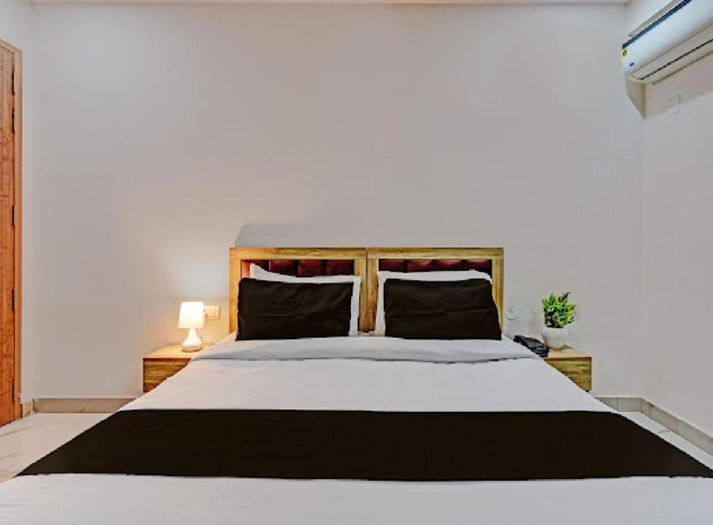 Postel nebo postele na pokoji v ubytování Akshay dream stay