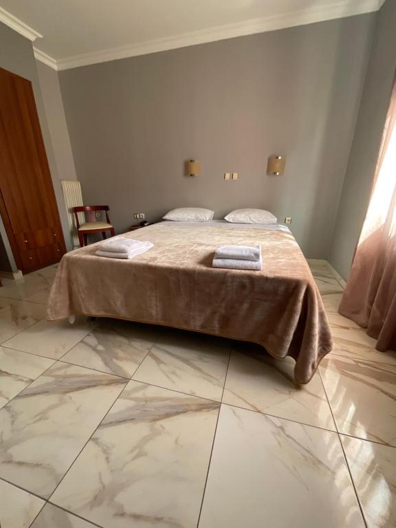 Postel nebo postele na pokoji v ubytování Piraeus Acropole Hotel