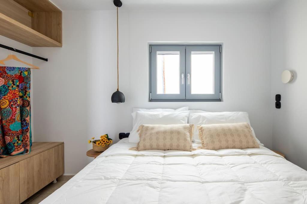 Voodi või voodid majutusasutuse Kea 360 VILLAS- Dionysos Den toas