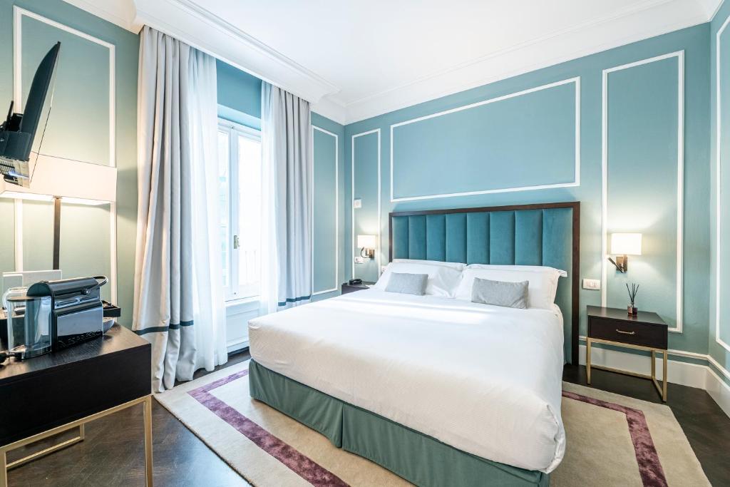 Postel nebo postele na pokoji v ubytování Glimpse Hotel