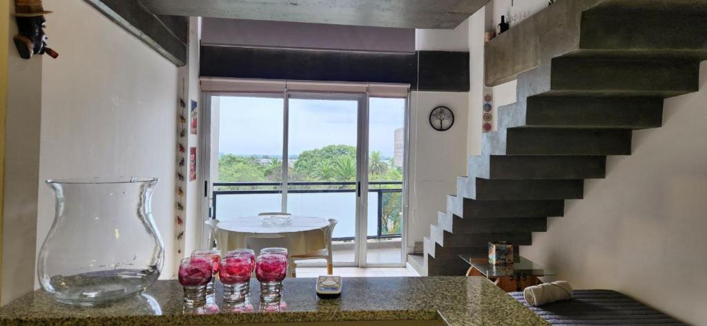 a group of wine glasses sitting on a counter in a room at Casita de Tucumán - Loft San Martin in San Miguel de Tucumán