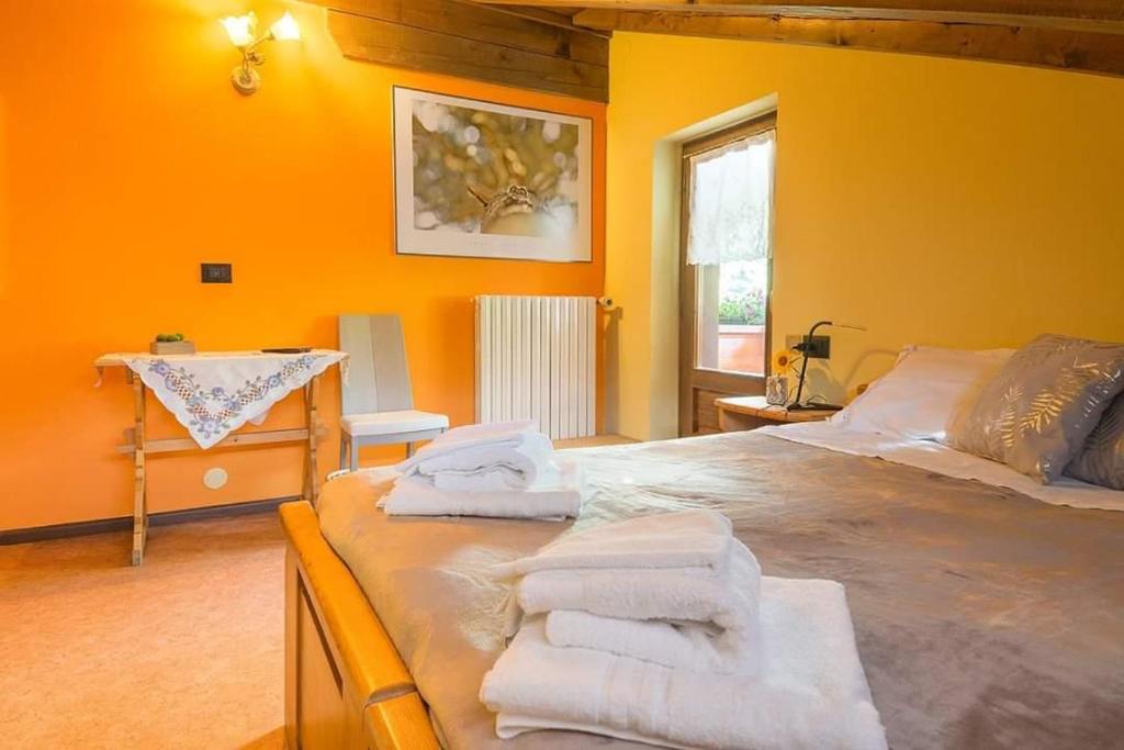 Postel nebo postele na pokoji v ubytování Al Mughetto