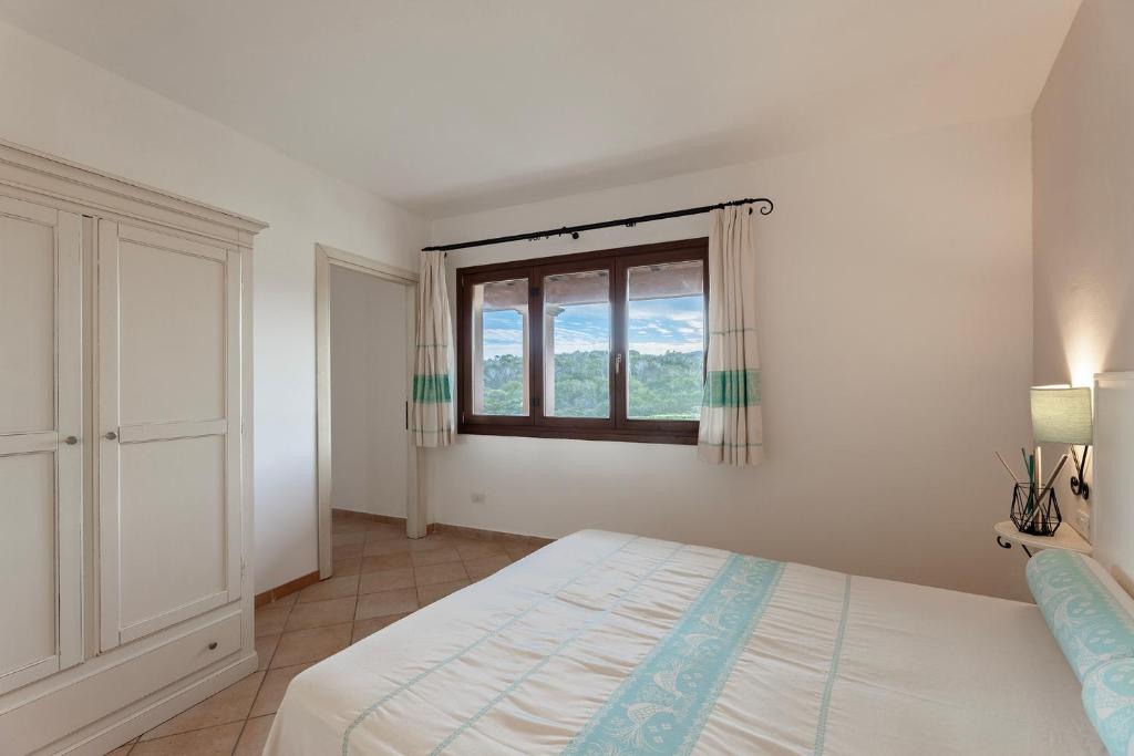Postel nebo postele na pokoji v ubytování Résidence Pierre & Vacances Vignola Mare
