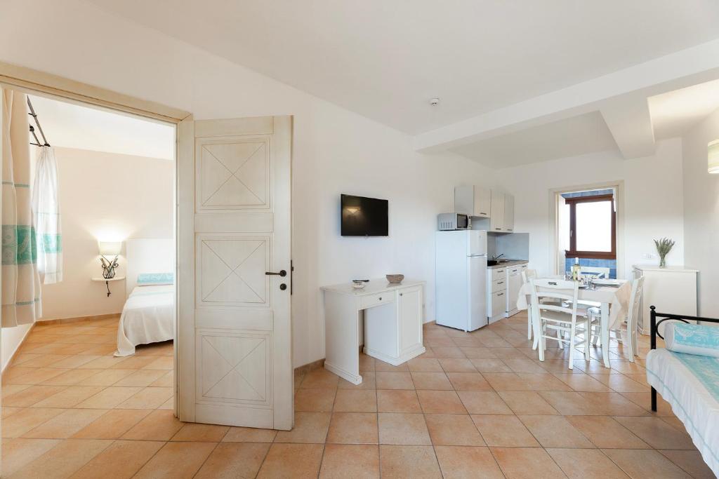 Kuchyň nebo kuchyňský kout v ubytování Résidence Pierre & Vacances Vignola Mare