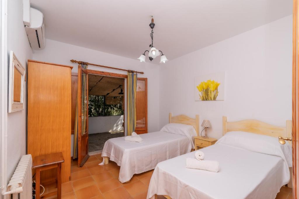 Postel nebo postele na pokoji v ubytování Villa Pi Tort by Sealand Villas