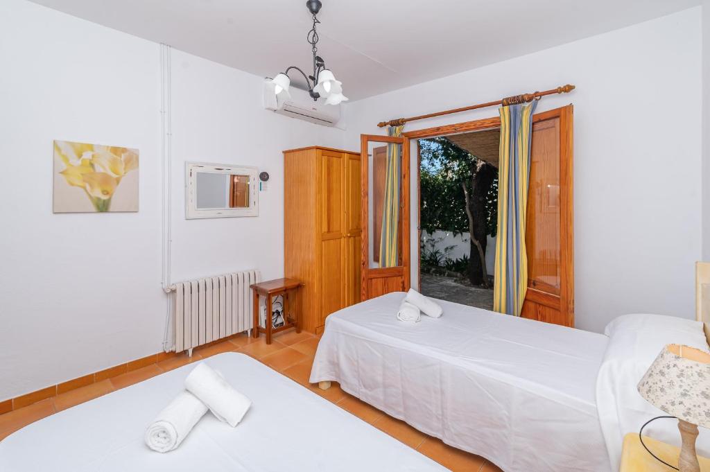 Postel nebo postele na pokoji v ubytování Villa Pi Tort by Sealand Villas