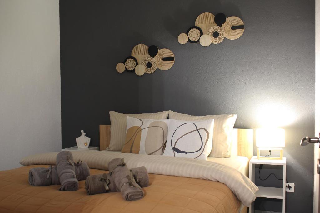 a bedroom with a large bed with hats on it at Center Of Elegance in Xanthi