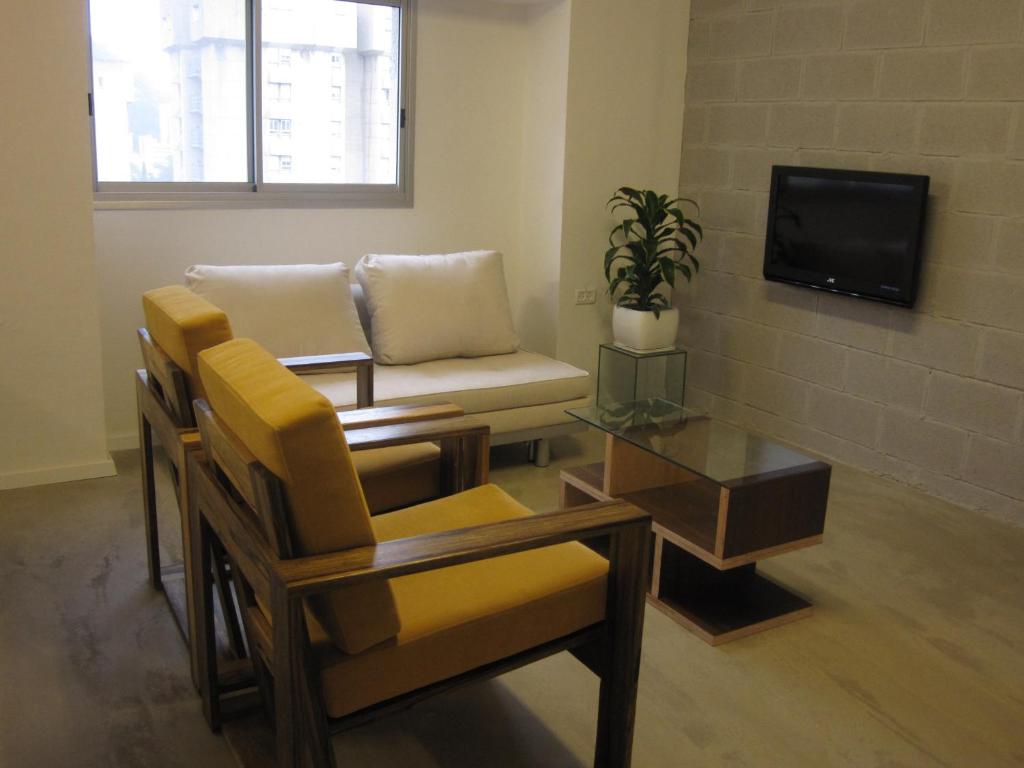 TV a/nebo společenská místnost v ubytování G38 Rental Apartment Building