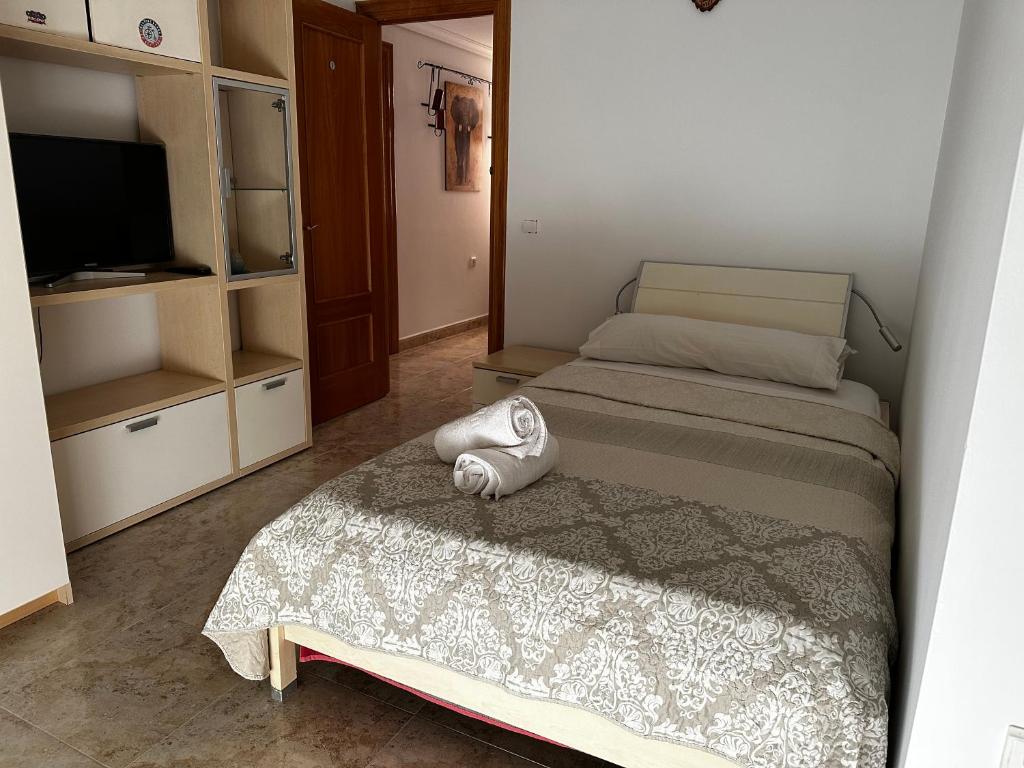 Postel nebo postele na pokoji v ubytování Habitaciones a 10 minutos de la playa de Aguadulce