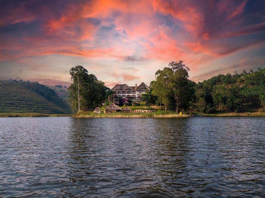 a house on an island in the middle of a lake at Birdnest Resort in Kabale