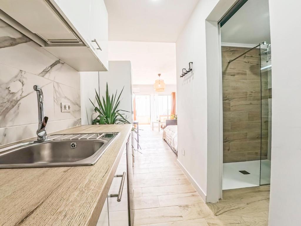 a kitchen with a sink and a shower at Casa Ari, Beautiful Ocean View in Morro del Jable
