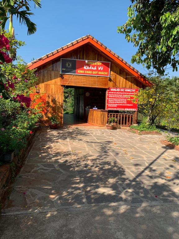 a building with a sign on the front of it at Motel Khánh Võ in Long Khanh