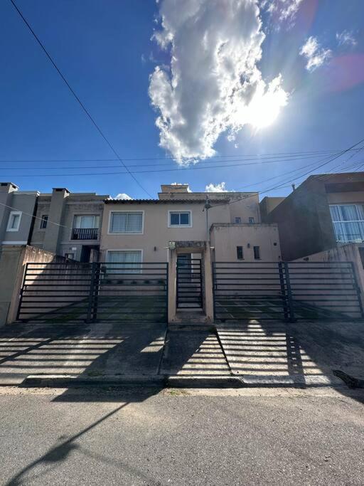 a building with stairs in front of a building at Departamento en planta baja con cochera in Salta