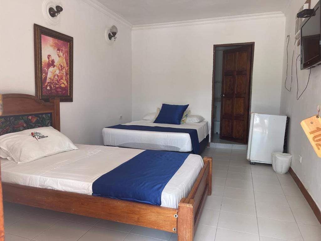 Postel nebo postele na pokoji v ubytování Hotel Posada San Sebastian