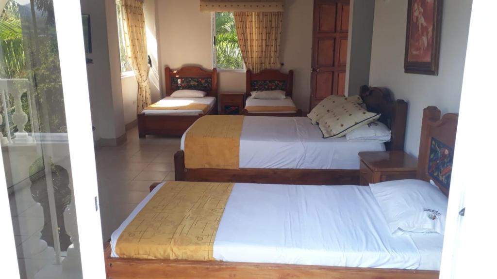 Postel nebo postele na pokoji v ubytování Hotel Posada San Sebastian