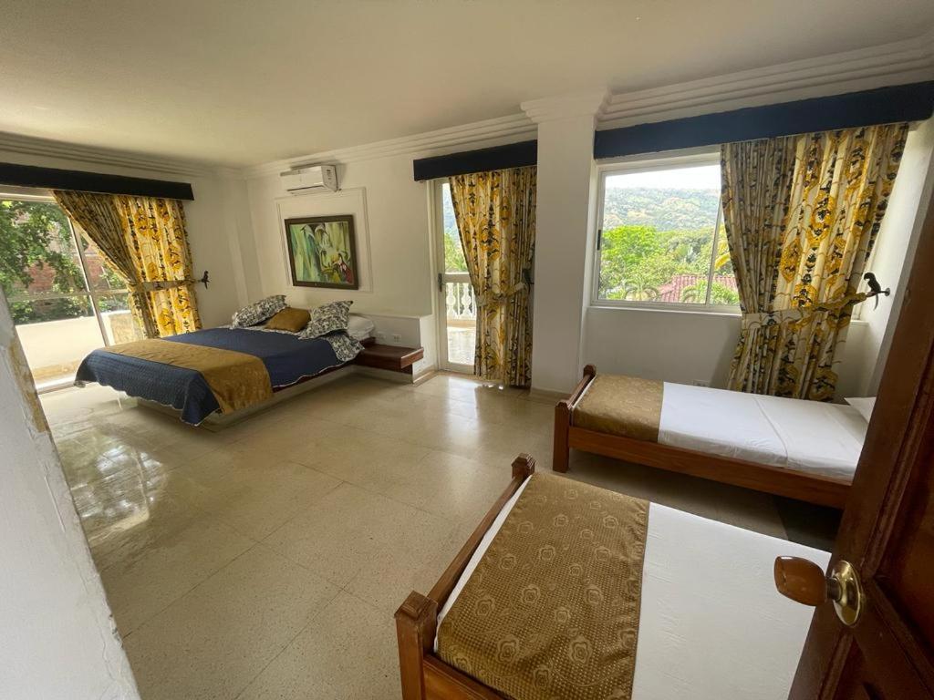 Postel nebo postele na pokoji v ubytování Hotel Posada San Sebastian