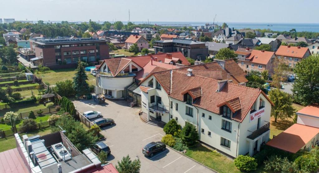 an aerial view of a town with a large house at Morena 206 in Klaipėda