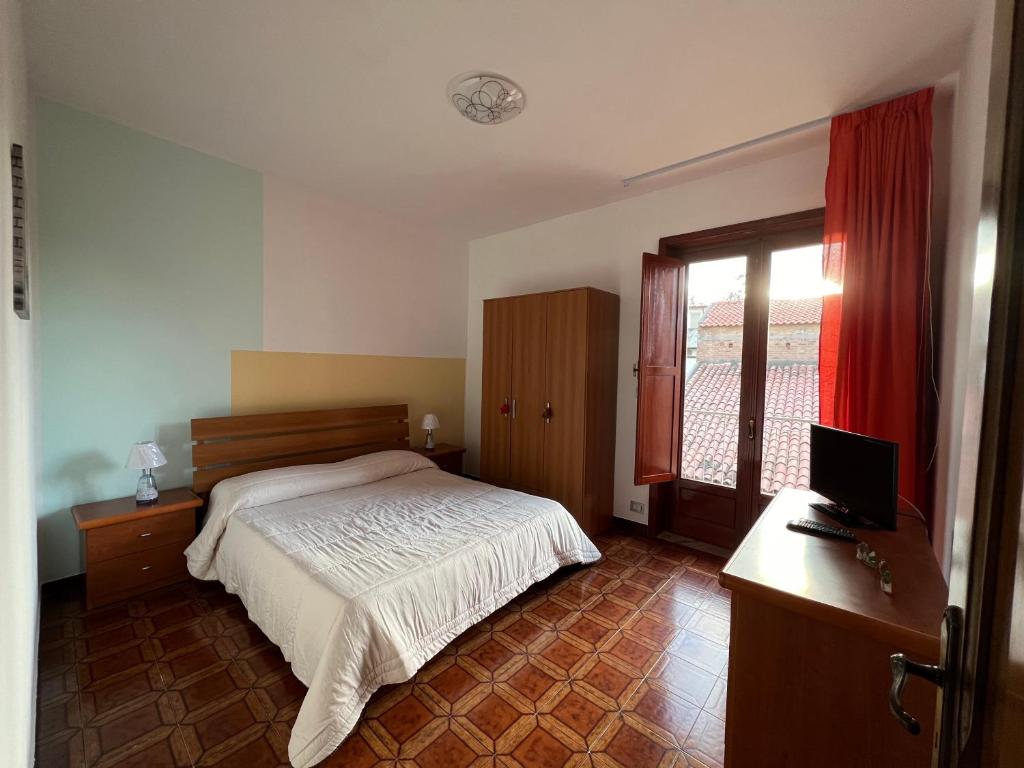 A bed or beds in a room at LA ROSA DEI VENTI