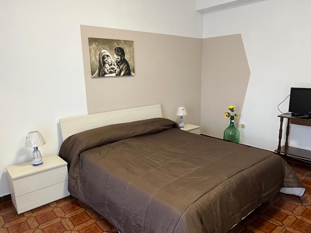 A bed or beds in a room at LA ROSA DEI VENTI