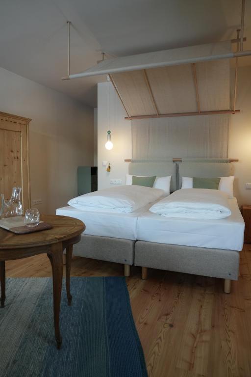 Postel nebo postele na pokoji v ubytování Hotel Kogler