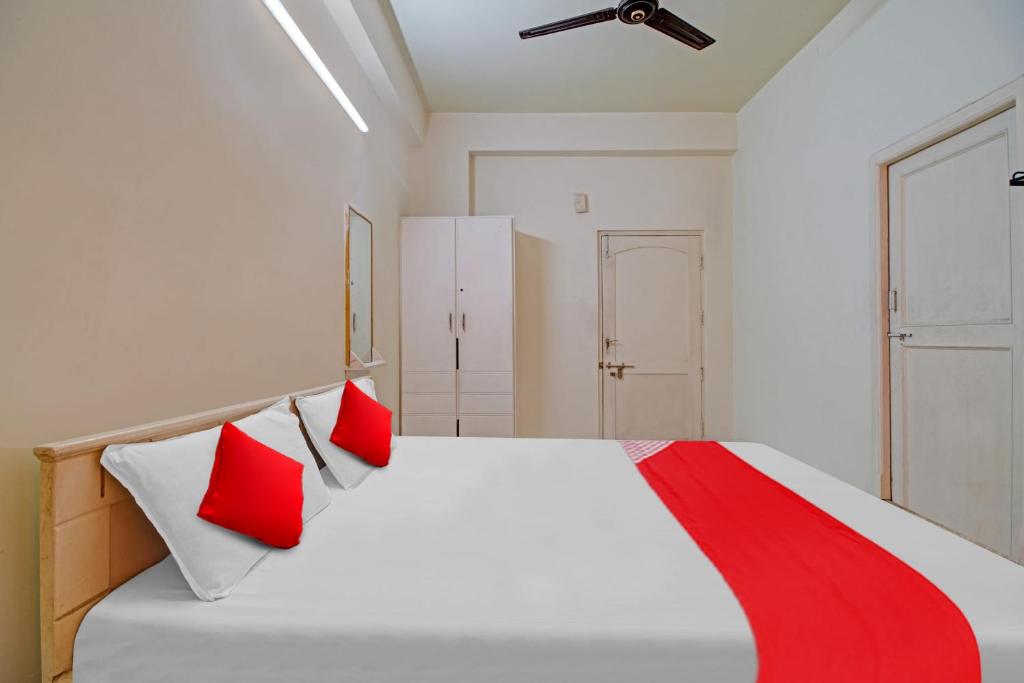 Krevet ili kreveti u jedinici u okviru objekta OYO Flagship Nrkm Residency