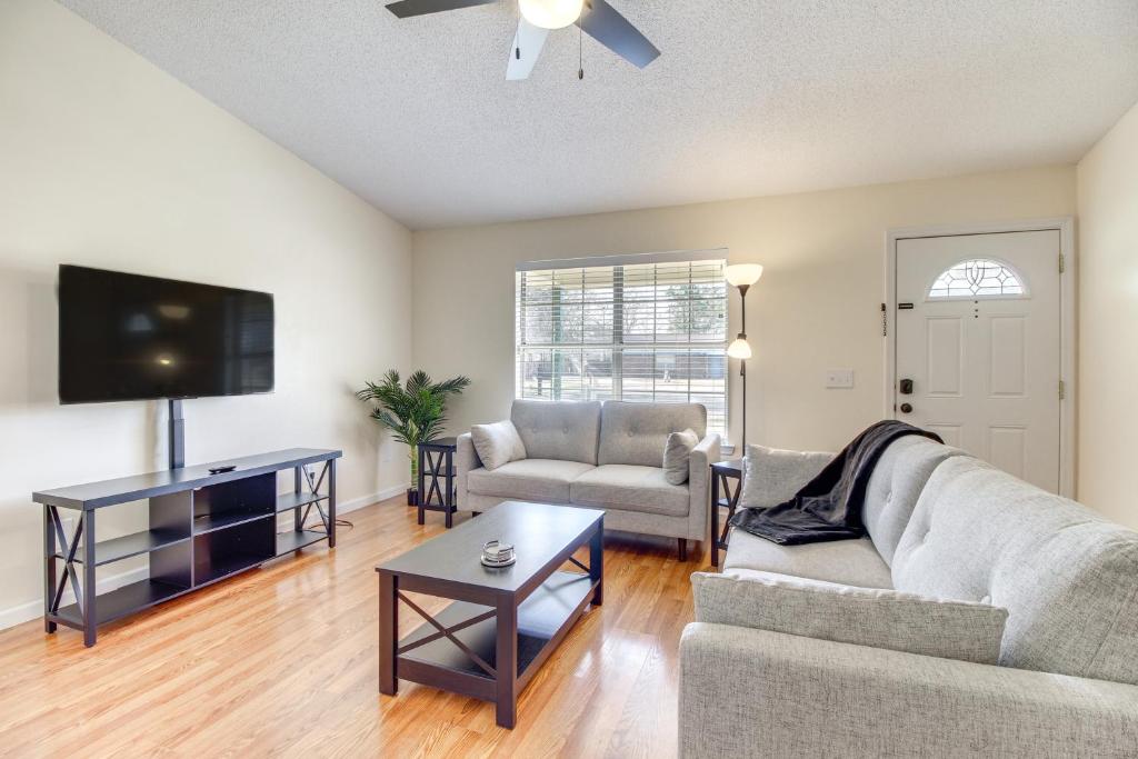a living room with a couch and a tv at Charming Hinesville Home Less Than 6 Mi to Fort Stewart in Hinesville