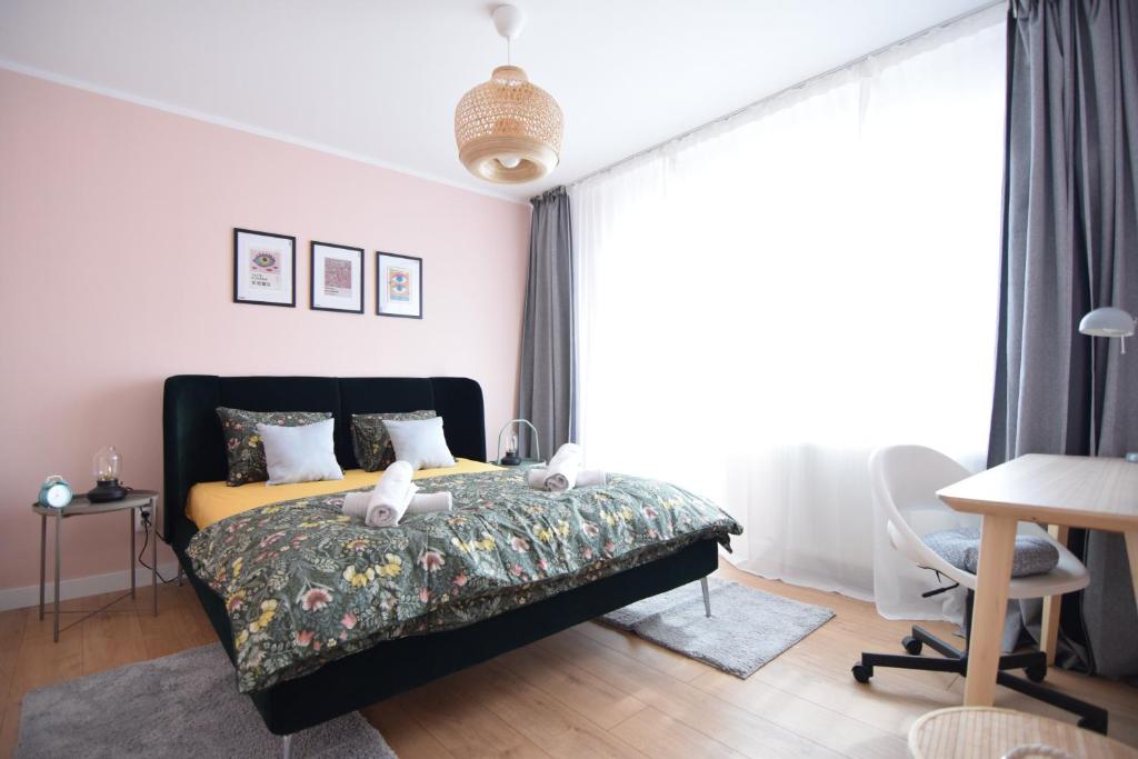 Ένα ή περισσότερα κρεβάτια σε δωμάτιο στο Stylish Apartment with video projector