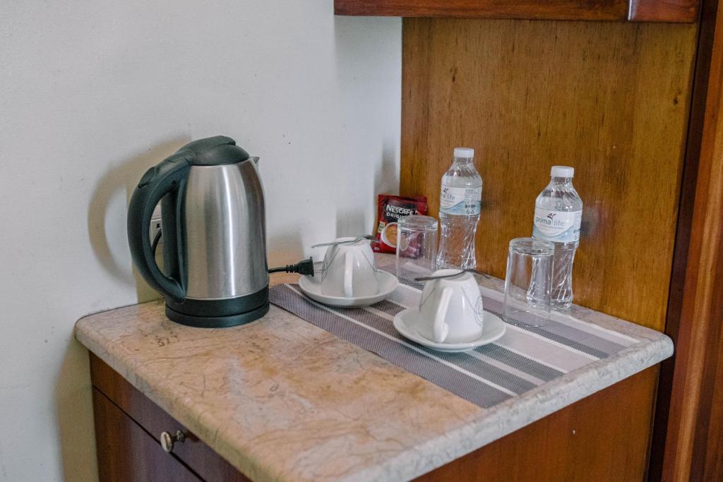Příslušenství pro přípravu čaje a kávy v ubytování Tsai Hotel and Residences