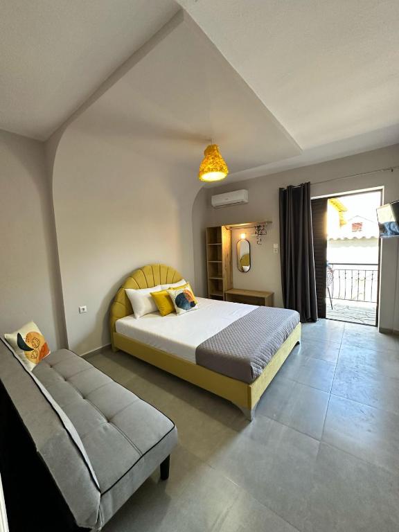 Ένα ή περισσότερα κρεβάτια σε δωμάτιο στο Room Nine 9 Beachfront Apartments