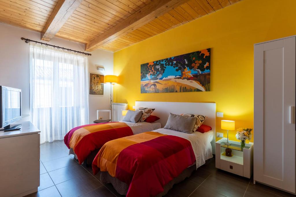 Ένα ή περισσότερα κρεβάτια σε δωμάτιο στο La Mariposa B&B