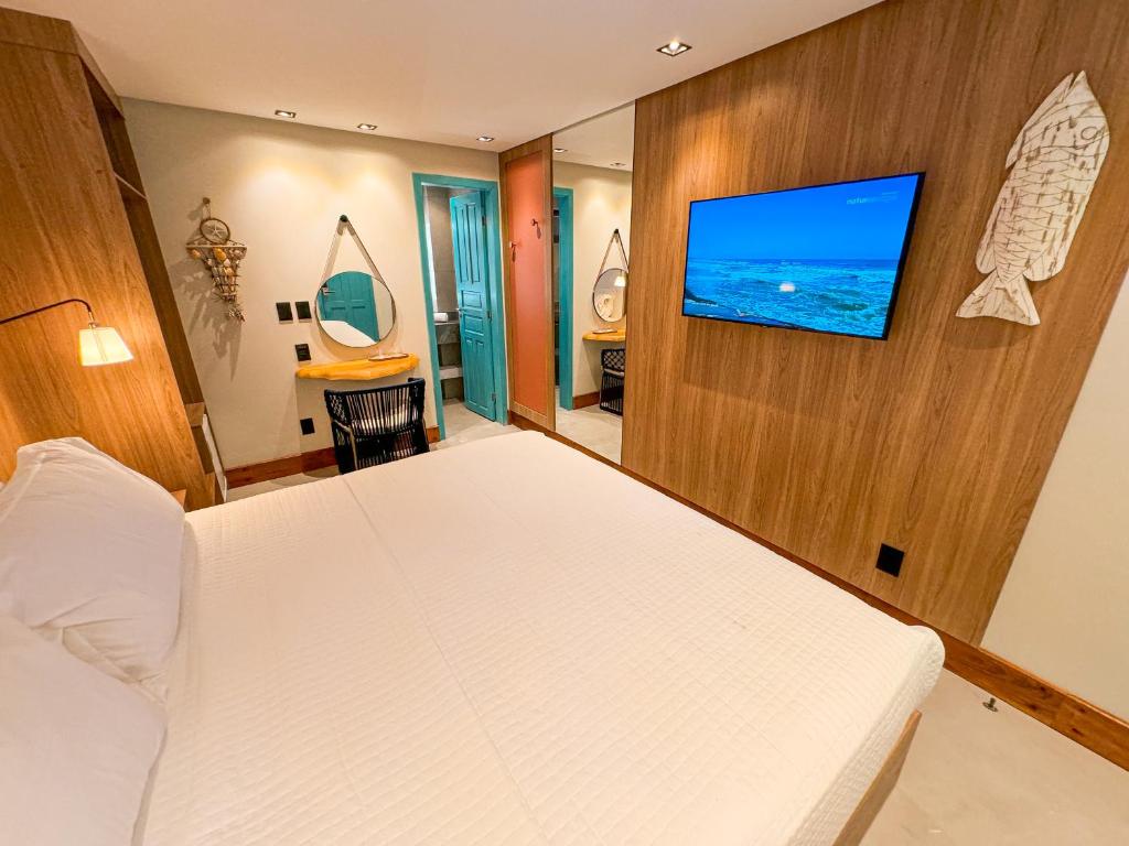 TV a/nebo společenská místnost v ubytování Poozendin Hotel de Charme