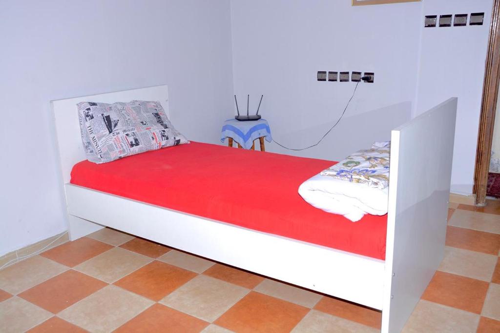 A bed or beds in a room at HN Home House with air conditioning