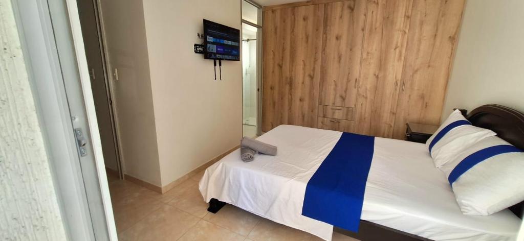 Postel nebo postele na pokoji v ubytování CB2 Somos AT HOME Apto tranquilo con Aire Acondicionado
