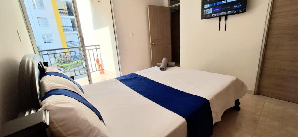 Postel nebo postele na pokoji v ubytování CB2 Somos AT HOME Apto tranquilo con Aire Acondicionado