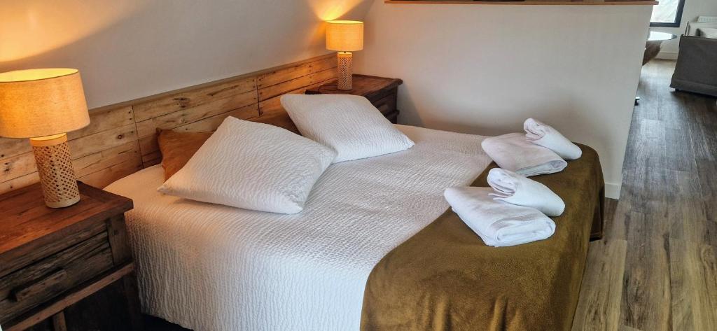 Postel nebo postele na pokoji v ubytování LE LOFT