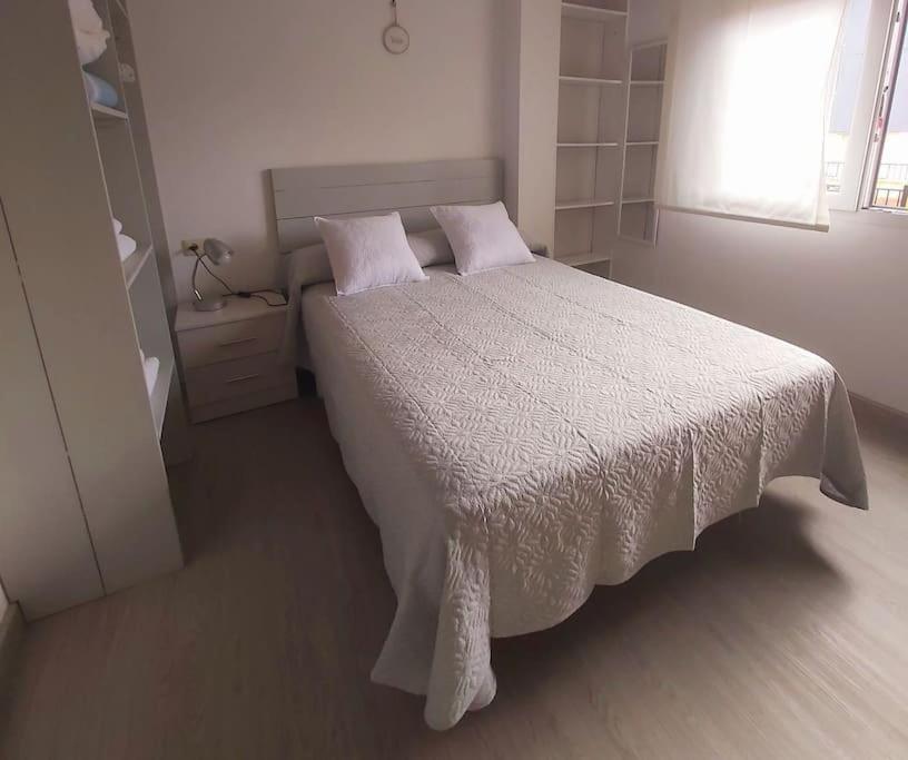 En eller flere senge i et værelse på Novama