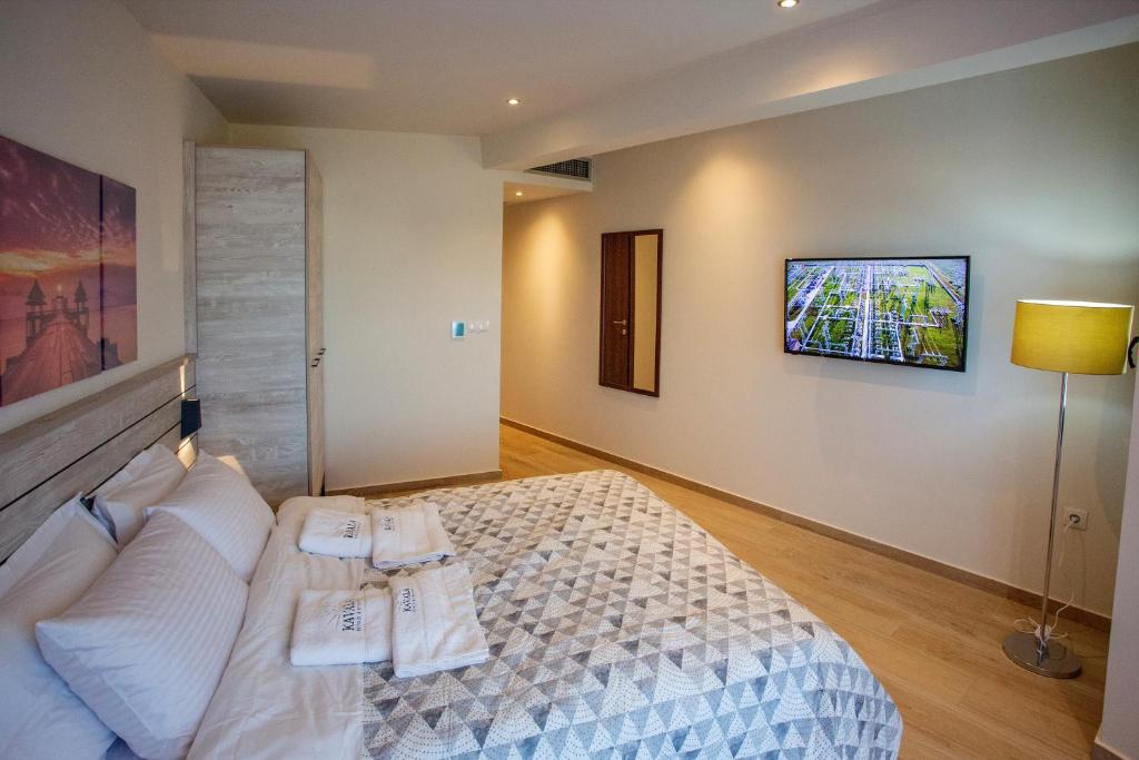 Postel nebo postele na pokoji v ubytování Kavala Resort & Spa