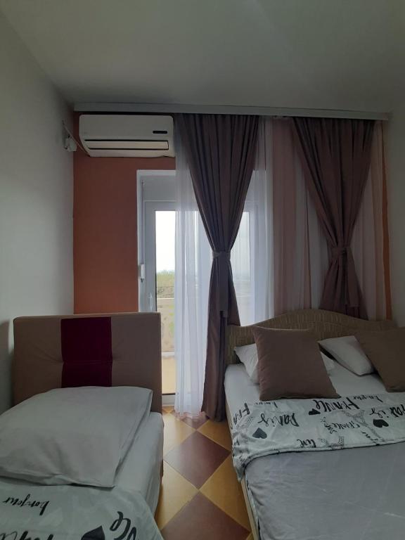 Postel nebo postele na pokoji v ubytování Becic Apartments
